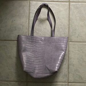 Woman’s purple handbag